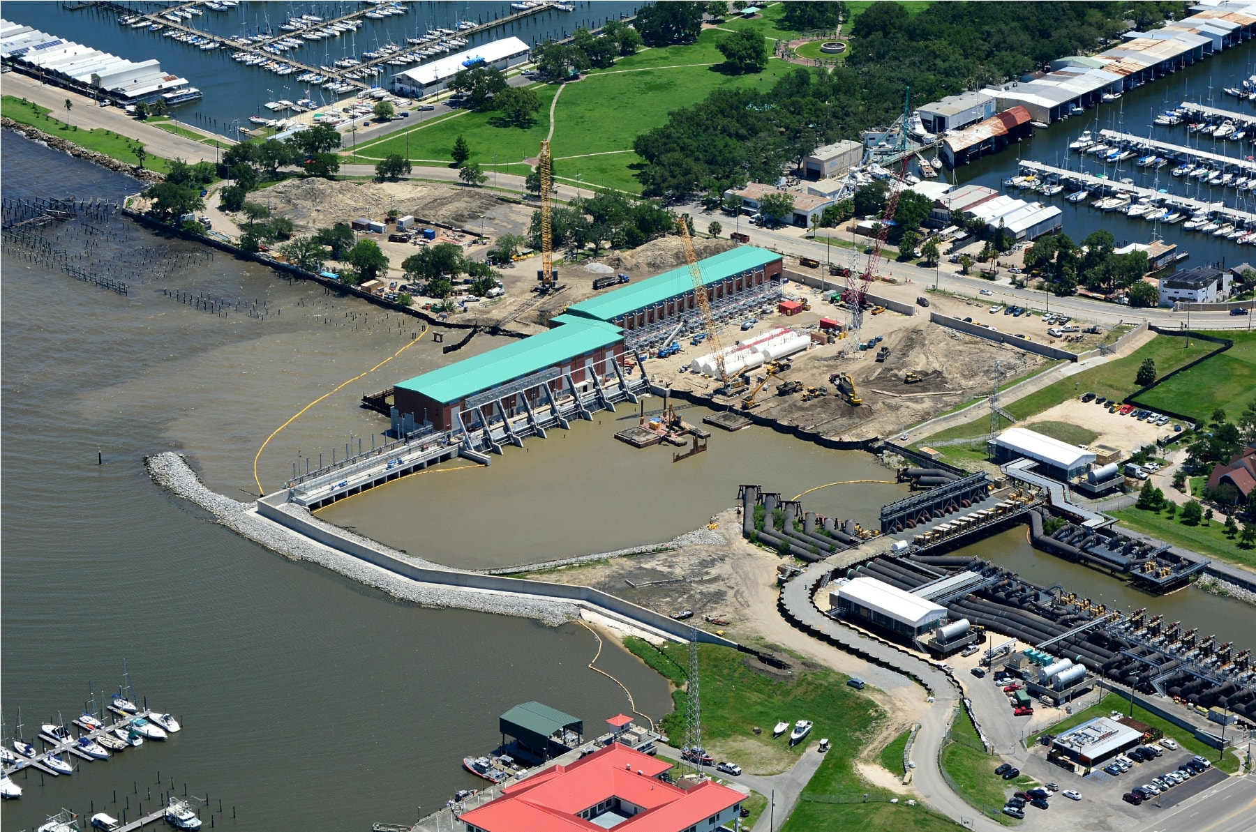 Aerial view of a pump station under construction along the New Orleans waterfront